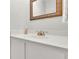 Stylish bathroom featuring a decorative mirror and sleek white countertop at 1021 Windy Oaks Se Ct, Smyrna, GA 30080