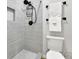 Modern bathroom showcasing a tiled shower with a black shower head and sleek fixtures at 1021 Windy Oaks Se Ct, Smyrna, GA 30080