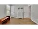 Neutral bedroom with a dresser, hardwood floors, and two large windows at 1021 Windy Oaks Se Ct, Smyrna, GA 30080