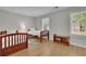 Comfortable bedroom with two twin beds, hardwood floors, and natural light at 1021 Windy Oaks Se Ct, Smyrna, GA 30080