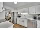 Modern kitchen featuring stainless steel appliances, white cabinetry, and durable countertops at 1021 Windy Oaks Se Ct, Smyrna, GA 30080