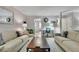 Well-lit living room with stylish decor, hardwood flooring, and an open layout at 1021 Windy Oaks Se Ct, Smyrna, GA 30080