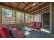 Cozy screened-in porch with comfortable seating and natural light at 1021 Windy Oaks Se Ct, Smyrna, GA 30080