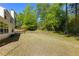 Expansive backyard with lush lawn and mature trees, perfect for outdoor activities and relaxation at 2181 Poplar Grove Ct, Snellville, GA 30078
