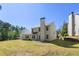 The lush backyard presents a spacious lawn and back view of the house at 2181 Poplar Grove Ct, Snellville, GA 30078