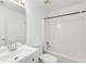 Bathroom featuring a toilet, bathtub/shower combo, mirror, vanity, and sink at 2181 Poplar Grove Ct, Snellville, GA 30078