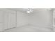 Bedroom with carpet, a ceiling fan and a closet with folding doors at 2181 Poplar Grove Ct, Snellville, GA 30078