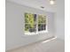 Bedroom with a large window showing a treed exterior view at 2181 Poplar Grove Ct, Snellville, GA 30078