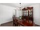 Formal dining room featuring an elegant chandelier, wooden table, and classic china cabinet at 2181 Poplar Grove Ct, Snellville, GA 30078