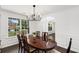 Inviting dining room with hardwood floors and elegant trim, featuring an archway to the entryway at 2181 Poplar Grove Ct, Snellville, GA 30078
