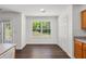 Eat-in kitchen with a view, featuring hardwood floors and bright, natural light at 2181 Poplar Grove Ct, Snellville, GA 30078