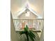 Upper view featuring hardwood floors, railings, attic window and ceiling fan at 635 Sw Queen Sw St, Atlanta, GA 30310