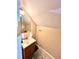 Bathroom with a sink, mirror, and lighting at 635 Sw Queen Sw St, Atlanta, GA 30310