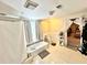 Bathroom with a bath, toilet, tiled floor and decorative shelf with items at 635 Sw Queen Sw St, Atlanta, GA 30310