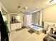 Bathroom with white tile flooring, white walls, bath tub with shower curtain, vanity, and mirror at 635 Sw Queen Sw St, Atlanta, GA 30310