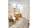 Bathroom with gray tile flooring, wood vanity, mirror, toilet, shower with curtain, and white door at 635 Sw Queen Sw St, Atlanta, GA 30310