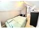 Cozy bedroom with a bed, dresser and sloped ceiling at 635 Sw Queen Sw St, Atlanta, GA 30310