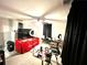 Bedroom showcasing carpet, ceiling fan, makeup lights, and storage areas at 635 Sw Queen Sw St, Atlanta, GA 30310