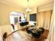 Dining room with hardwood floors, a chandelier, and access to the kitchen with stainless steel appliances at 635 Sw Queen Sw St, Atlanta, GA 30310