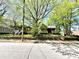 Quaint home with a welcoming front porch, surrounded by lush trees and landscaping at 635 Sw Queen Sw St, Atlanta, GA 30310