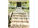 Charming home featuring inviting front porch with yellow door and attractive landscaping at 635 Sw Queen Sw St, Atlanta, GA 30310