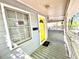 Inviting front porch featuring a bright yellow door and a cozy seating area at 635 Sw Queen Sw St, Atlanta, GA 30310