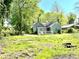 Charming single-Gathering home with a covered porch and spacious front yard surrounded by mature trees at 635 Sw Queen Sw St, Atlanta, GA 30310