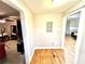 Hallway with hardwood floors that connects the two rooms at 635 Sw Queen Sw St, Atlanta, GA 30310