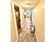 Hallway leading to a bathroom, kitchen, and bedroom, with hardwood floors throughout the home at 635 Sw Queen Sw St, Atlanta, GA 30310