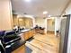 Spacious kitchen featuring stainless steel appliances, wood cabinetry, and hardwood flooring at 635 Sw Queen Sw St, Atlanta, GA 30310