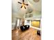 Bright living room featuring hardwood floors, high ceilings, and a loft area at 635 Sw Queen Sw St, Atlanta, GA 30310
