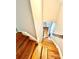 View of wooden staircase leading into a room with hardwood flooring and curtains at 635 Sw Queen Sw St, Atlanta, GA 30310
