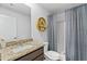 Modern bathroom featuring granite countertops, a shower with curtain and stylish decor at 734 Great Oak Pl, Villa Rica, GA 30180