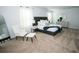 Spacious bedroom featuring a plush bed, accent furniture, and generous natural light from windows at 734 Great Oak Pl, Villa Rica, GA 30180