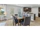 A dining room area has wooden floors and table with seating for six at 734 Great Oak Pl, Villa Rica, GA 30180