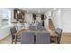 Open dining room with modern decor leading to a kitchen area and staircase at 734 Great Oak Pl, Villa Rica, GA 30180