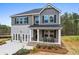 Charming two-story home with brick accents, covered porch, and well-maintained landscaping at 734 Great Oak Pl, Villa Rica, GA 30180