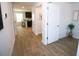 Hallway with wood floors leading to kitchen and dining area at 734 Great Oak Pl, Villa Rica, GA 30180