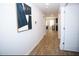 Bright hallway with wood floors leading to the kitchen and dining area at 734 Great Oak Pl, Villa Rica, GA 30180