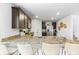 Spacious kitchen with a granite countertop island and stainless steel refrigerator at 734 Great Oak Pl, Villa Rica, GA 30180