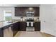 Well-equipped kitchen with stainless steel appliances and granite countertops at 734 Great Oak Pl, Villa Rica, GA 30180