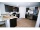 Modern kitchen with stainless steel appliances and dark wood cabinets at 734 Great Oak Pl, Villa Rica, GA 30180