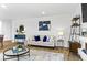 Sunlit living room with stylish decor, modern furnishings, and an open layout at 734 Great Oak Pl, Villa Rica, GA 30180
