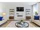 Cozy living room with a modern fireplace, neutral decor, and ample seating at 734 Great Oak Pl, Villa Rica, GA 30180