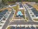 Overhead shot of a new home community, featuring a central pool, clubhouse, and well-maintained landscaping at 1030 Sutherland Lane (Lot 46), Lawrenceville, GA 30043