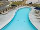 Close up aerial photograph of a community pool surrounded by tables, lounge chairs, and sun umbrellas at 1030 Sutherland Lane (Lot 46), Lawrenceville, GA 30043