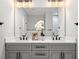 Bathroom with double sink vanity, modern fixtures, and ample lighting for a bright, functional space at 106 Hogue St, Atlanta, GA 30312