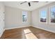 Bright bedroom featuring hardwood floors and large windows offering city views at 106 Hogue St, Atlanta, GA 30312