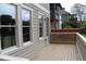 Wide deck overlooking the backyard featuring a light-colored wood and white railings at 106 Hogue St, Atlanta, GA 30312