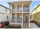 Charming two-story home featuring a welcoming front porch with white railings and a brick foundation at 106 Hogue St, Atlanta, GA 30312